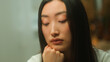 © Yuliia - Asian chinese korean disappointed sad woman girl lonely japanese lady female girlfriend upset thoughtful looking down think difficult trouble sorrowful worried depression sick health problem medicine