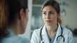 © phy - A female doctor discussing medical results with a patient in a calm, professional environment.
