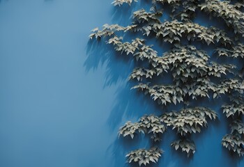 Wall Mural - green leaves cascading over a textured blue wall background in a natural style