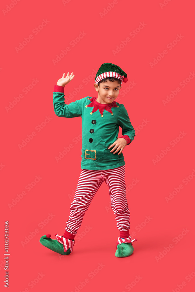 Cute little elf waving hand on red background