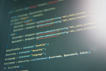 code in the spotlight: a close-up shot of lines of code on a computer screen, illuminated by a soft 