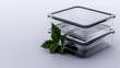 © TK - Stackable glass containers with a fresh green herb accent, ideal for food storage and meal prep