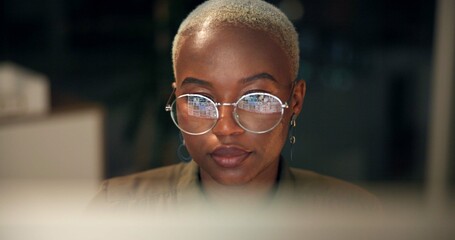 Poster - Black woman, glasses and computer in office for news, business research and reflection at night. Economy journalist, tech or reading in agency for article resource, proofreading or stock market study
