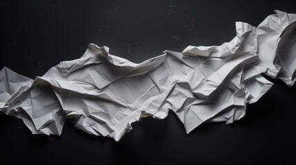 Canvas Print - Crumpled white paper texture on a dark background showcasing intricate folds and creases for creative design and artistic projects.
