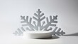 © saratm - Empty white podium in shape of a snowflake on white background