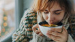 © mahamad - Ill woman eating chicken soup at home, close-up.
