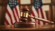 © nimaxs - A wooden gavel rests on a sound block, with American flags displayed in the background, symbolizing justice and the legal system.