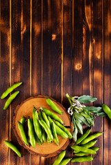 Wall Mural - Green beans close up top view background.