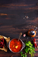 Poster - Meat solyanka soup with sausages, olives and vegetables served on wooden table