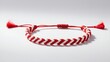 © Natallia - Handmade red and white braided bracelet on a light background, knitted jewellery, martenitsa, bulgarian holiday