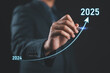 © Nirusmee - 2025 new year, new business start up, target, goal action plan for success growth, market trend 2024-2025, Annual plan development. Businessman draws increase arrow challenge business strategy