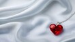 © Jack - A captivating display of a ruby heart necklace on white fabric, with ample room for messaging,