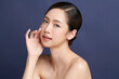 © kitthanes  - Beautiful young asian woman with clean fresh skin on blue background, Face care, Facial treatment, Cosmetology, beauty and spa, Asian women portrait.