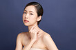 © kitthanes  - Beautiful young asian woman with clean fresh skin on blue background, Face care, Facial treatment, Cosmetology, beauty and spa, Asian women portrait.
