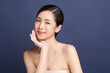 © kitthanes  - Beautiful young asian woman with clean fresh skin on blue background, Face care, Facial treatment, Cosmetology, beauty and spa, Asian women portrait.