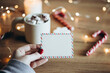 © sav_an_dreas - Hand holds empty postcard with Christmas background, copy space.