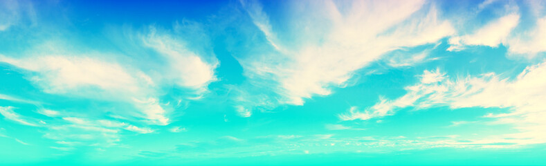 Wall Mural - Blue cloudy sky on a sunny day. Sky texture. Abstract nature background. Horizontal banner