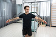 © chachamp - Caucasian men training pilates with pilates equipment in fitness studio