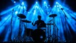 © Larysa - Silhouette of a Drummer on a Stage Under Blue Lights