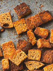 sliced ​​bread crackers on a dark background close-up, top view