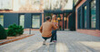 © ihorvsn - Camera view Caucasian dad expecting his lovely daughter after school lessons. Pretty girl with teddy bear in her hands running to father. Child sharing good feelings and telling news during day.