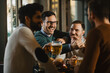 © Novak - Group of friends have beer time in pub