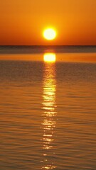 Wall Mural - beauty landscape with sunrise over sea. vertical video