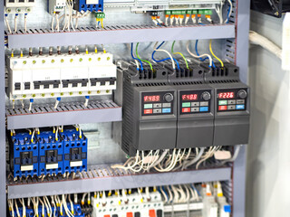 Wall Mural - Electrical equipment. Power panel with automatic switches to cut off electricity supply. Industrial automation equipment. Electrical equipment control panel. Machines and meters inside power panel