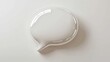© Albert - a white speech bubble on a white background The speech bubble is made of glass and has a glossy finish It is the focal point of the image, with the white backgrou