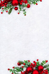 Wall Mural - christmas decoration. red christmas balls, red berries, branches christmas tree on snow with space f