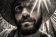© vefimov - A traveler wearing a straw hat, beard and backpack exploring wilderness with sunlight shining on his face.