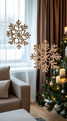 Wall Mural - Hanging paper snowflakes create a festive atmosphere in a cozy space adorned with a Christmas tree and candles glowing softly in natural light