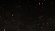 © Alesia - Glowing cinematic fire particles rising up with smoke and haze. Fire sparks flying fast with the wind. Bonfire, fire flakes background, fire ashes flow. Hot burning blaze, big flame, and disaster.