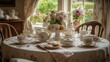 © Nuttaya Nampai - Elegant Table Setting for Afternoon Tea with Floral Arrangements