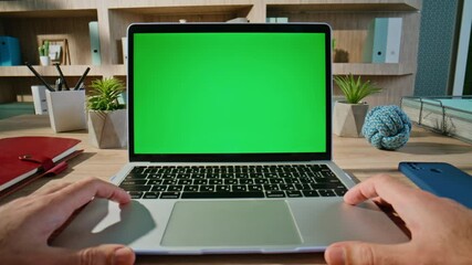 Wall Mural - Student browsing lesson green screen laptop in organized workspace closeup. 