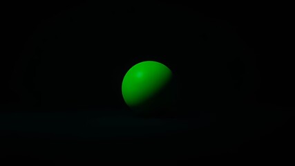 Wall Mural - A single bright green sphere rests in the darkness, illuminated by a single light source