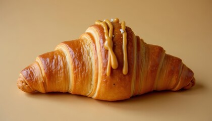 Poster -  Deliciously flaky croissant with a rich golden caramel glaze