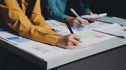 UX developer and ui designer brainstorming about mobile app interface wireframe design with customer breif and color code. business working