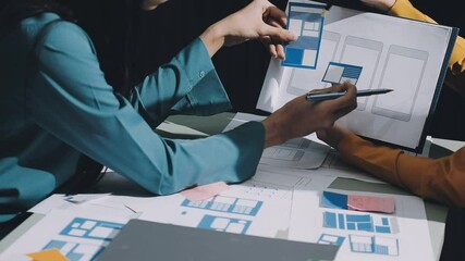 Wall Mural - ux developer and ui designer brainstorming about mobile app interface wireframe design with customer