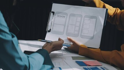 Wall Mural - ux developer and ui designer brainstorming about mobile app interface wireframe design with customer