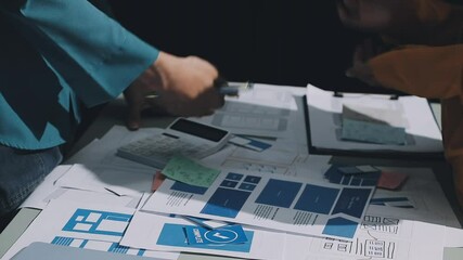 Wall Mural - ux developer and ui designer brainstorming about mobile app interface wireframe design with customer