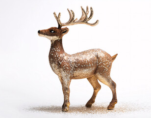 Wall Mural - A golden reindeer figurine with sparkling glitter, standing tall on a white background