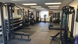 © Boonnam Burart - Modern Fitness Center with Diverse Equipment for Strength Training