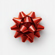 © seogi - Close-up of a one shiny bow decoration made of red ribbon.Isolated on white background. Top view. Christmas, xmas, New Year, Birthday, Anniversary, Celebration, Gift, Packaging, Decoration.