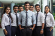 © PIX OF WORLD AI - young indian business people group standing together