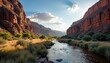 © vivekFx - A river flowing through a rocky canyon with red walls and green vegetation