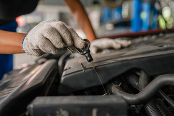 Wall Mural - Closeup of auto mechanic are using the wrench to repair auto engine