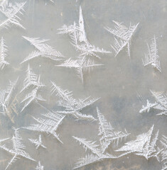 Wall Mural - A beautiful scene of snowflakes on a surface