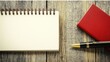 © Maxim Borbut - On a wooden table lie a blank notebook and a pen, offering a serene setting for unleashing creativity and gathering inspiration.