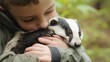 © vlntn - Young Boy Holding a Badger Tenderly